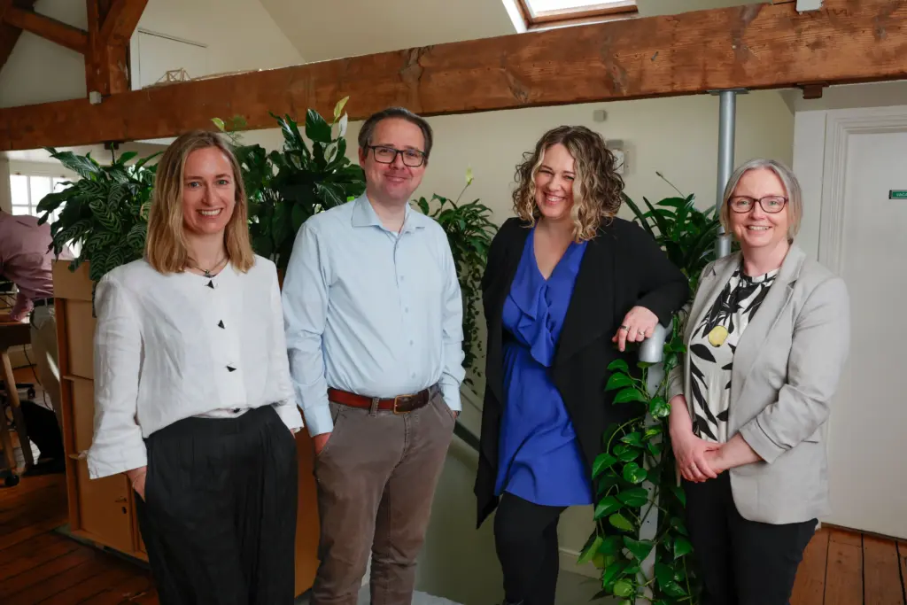 HR and Admin Team - three women and a man standing facing the camera
