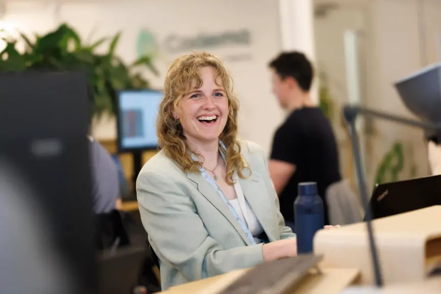 An image of Katie Harrington from Codema smiling at her desk.