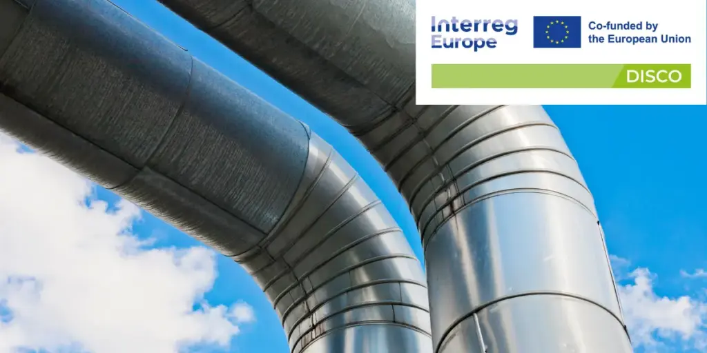 Image of district heating pipes and the sky, overlayed with DISCO project logo.