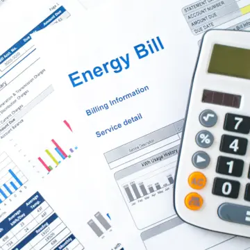 Image of an energy bill and a calculator.
