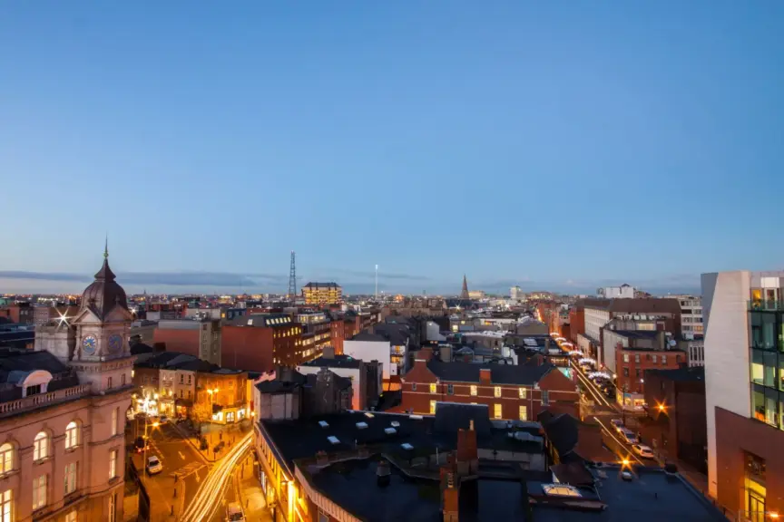 Picture of building rooftops over Dublin City as evening sets in.