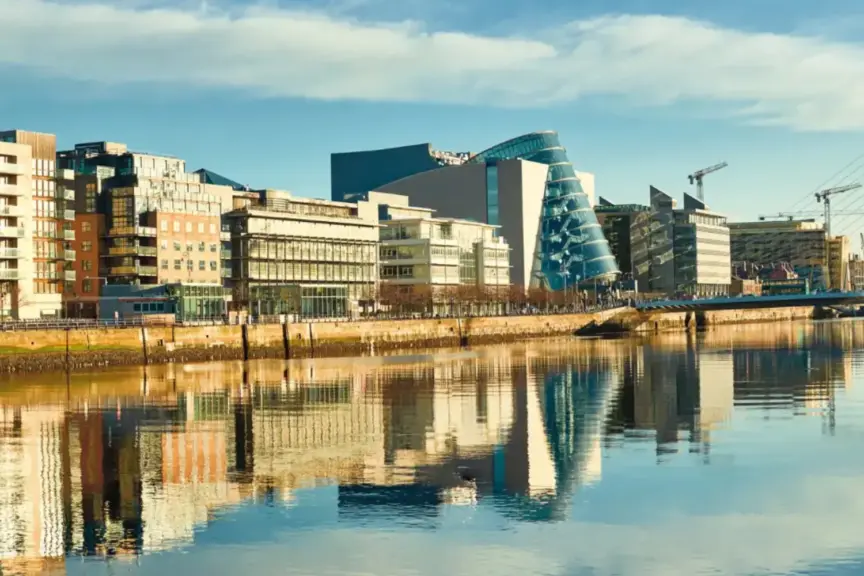 Image showing a blue sky and buildings along the quays in Dublin City, including the Dublin Convention Centre.
